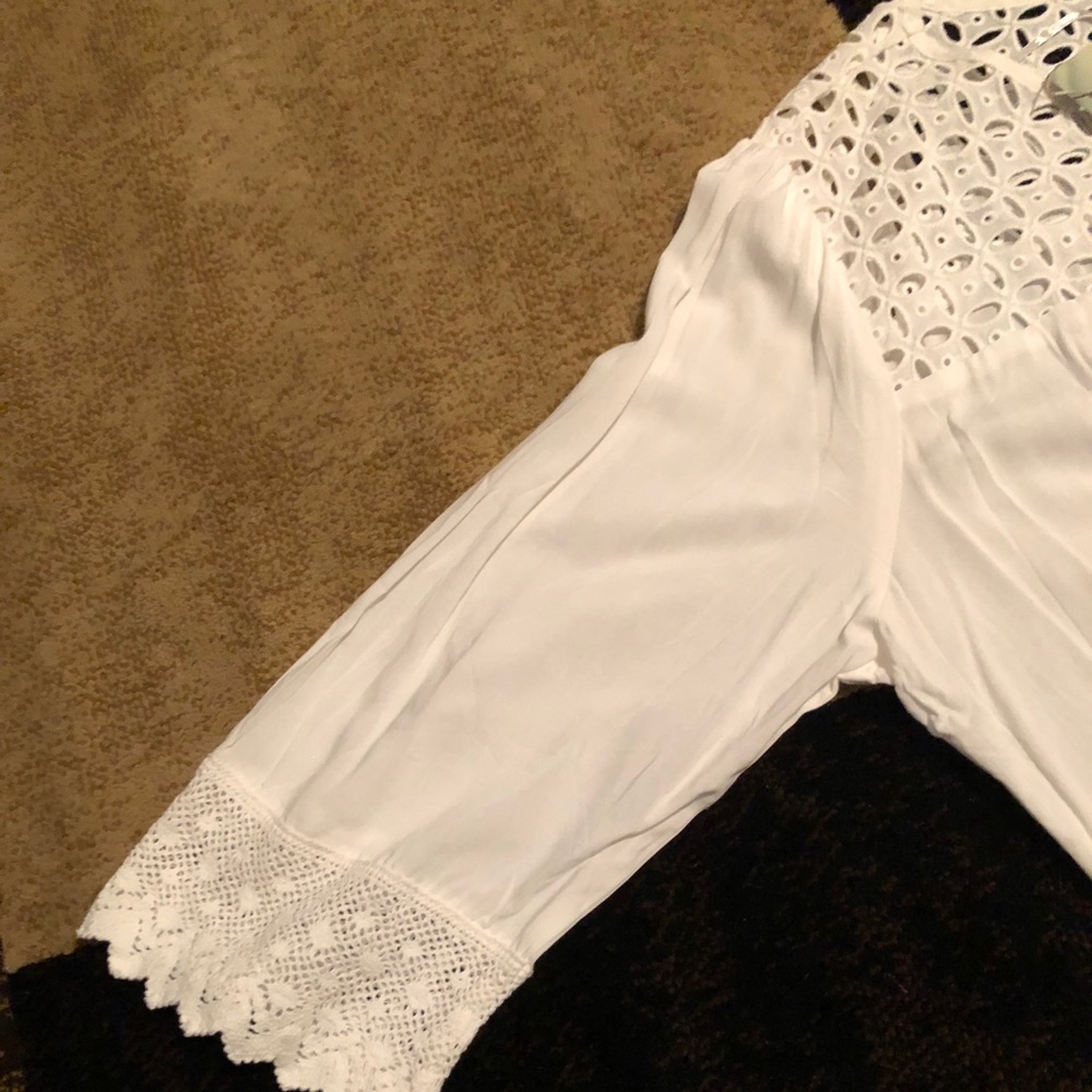 nice long sleeve top with a lace like front